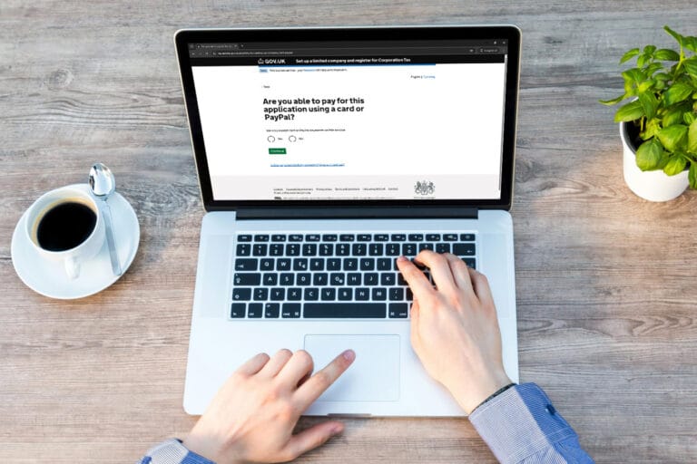 Somebody using a laptop using the gov.uk website to register their business