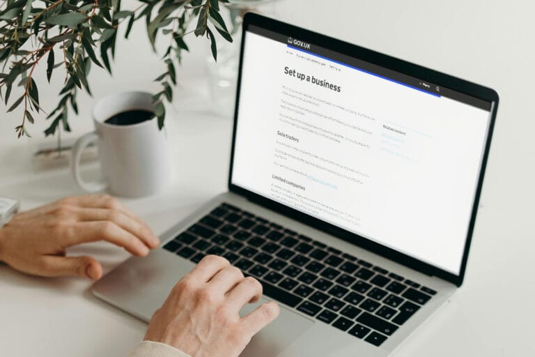 A person using their laptop to research how to start up a business